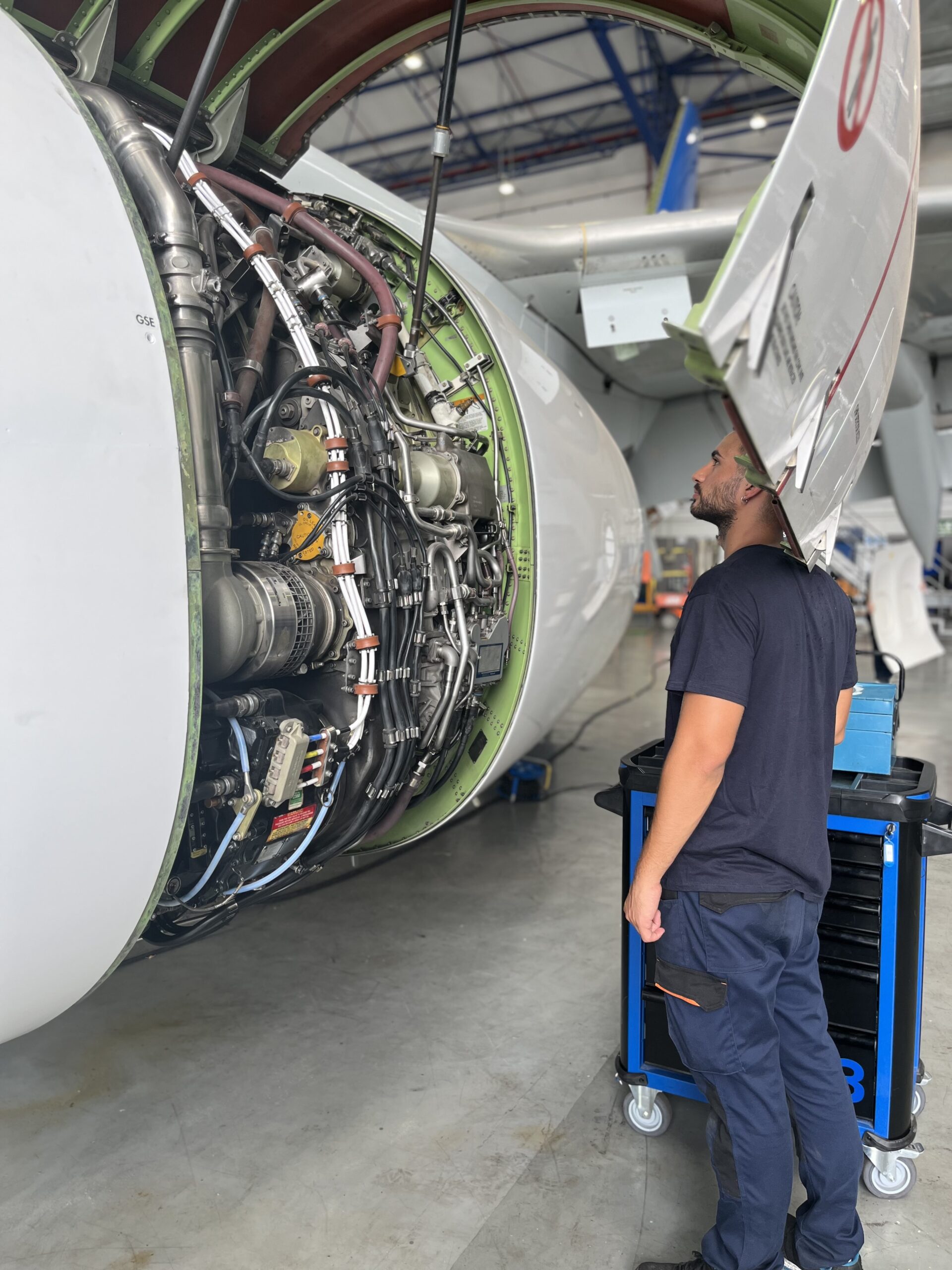 Technicians looking at an engine